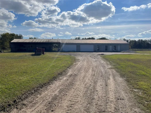 a view of house with yard and ocean view