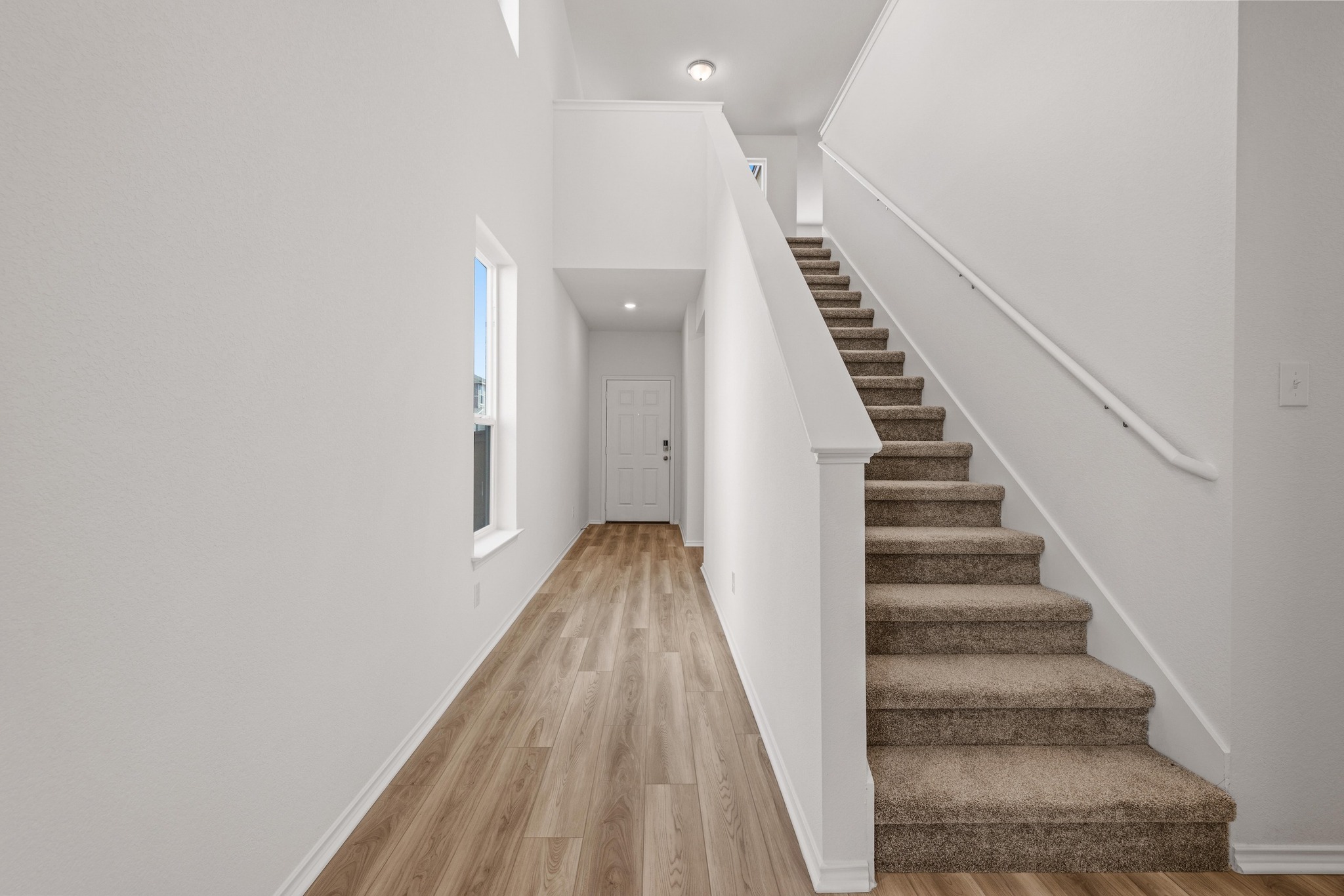 260 Feathers Street Jarrell, TX 76537 - Photo 7 of 34 a view of entryway with wooden floor