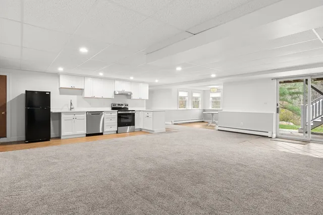 a view of a kitchen with a sink and cabinets