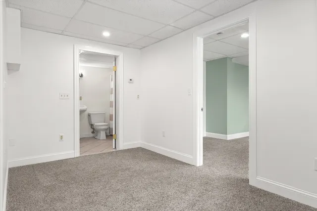 an empty room with a bathroom