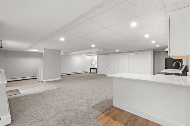 a view of a kitchen with a sink and a stove top oven