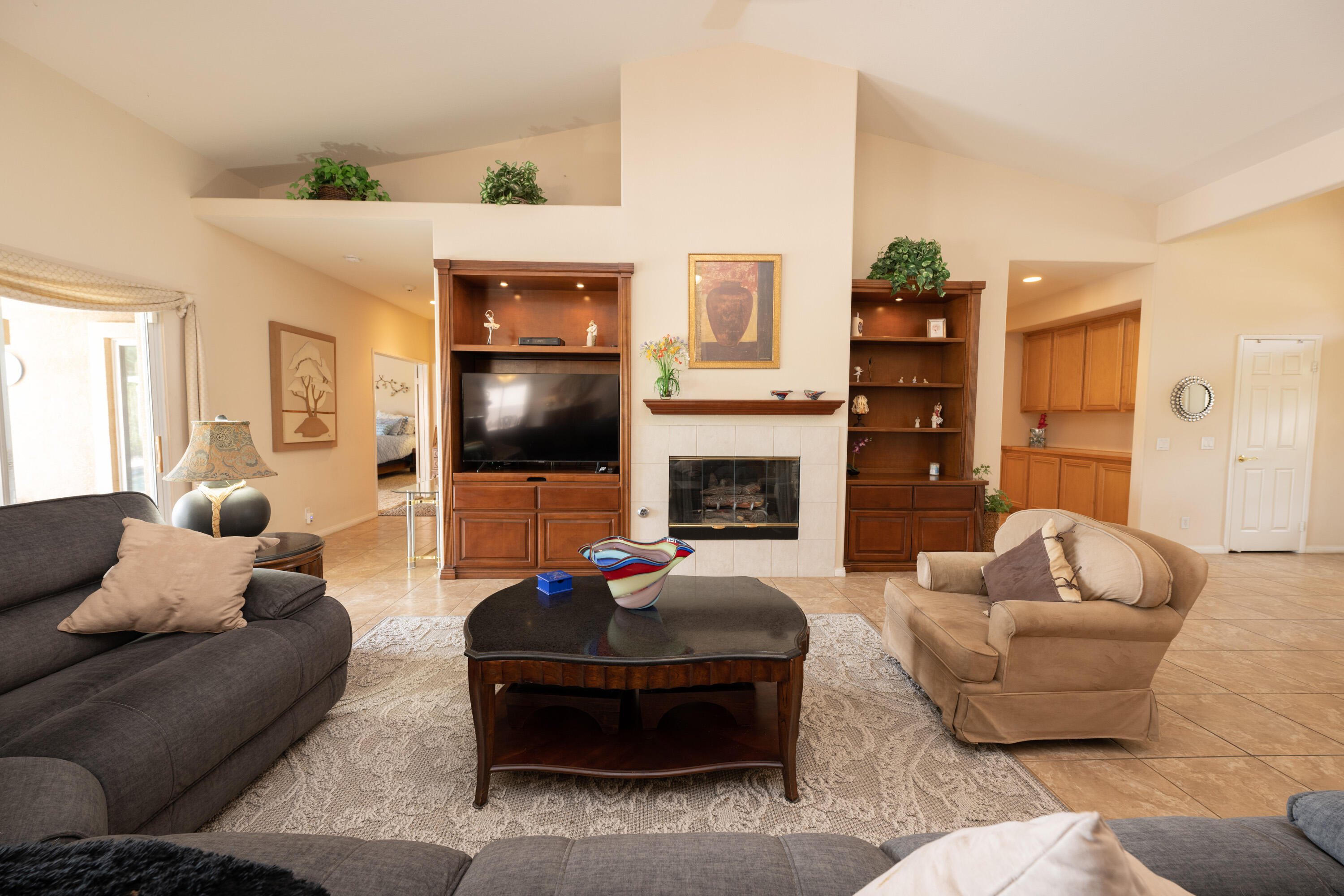 80307 Green Hills Drive Indio, CA 92201 - Photo 13 of 48 a living room with furniture and a fireplace