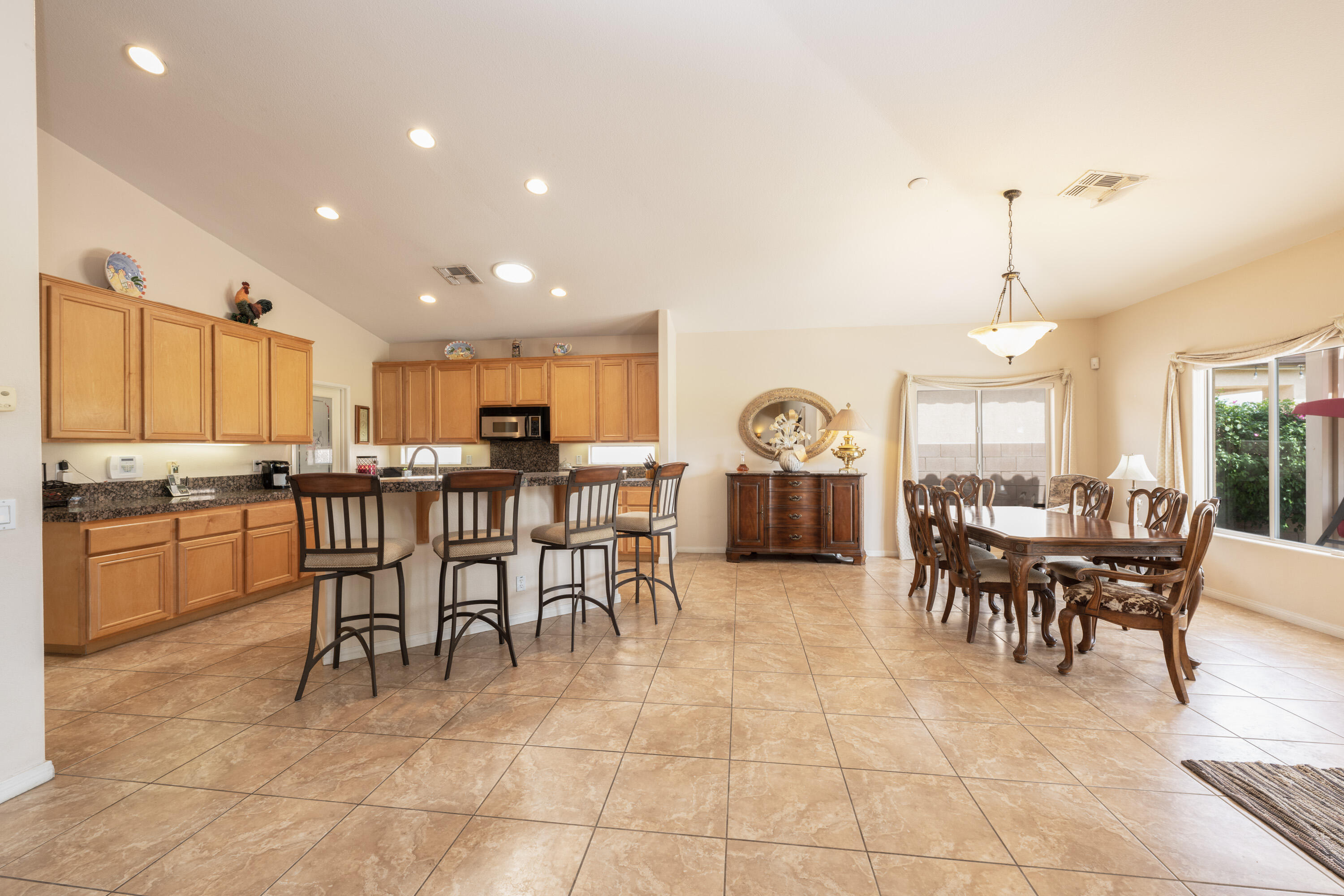 80307 Green Hills Drive Indio, CA 92201 - Photo 14 of 48 a view of a dining area with furniture window and outside view