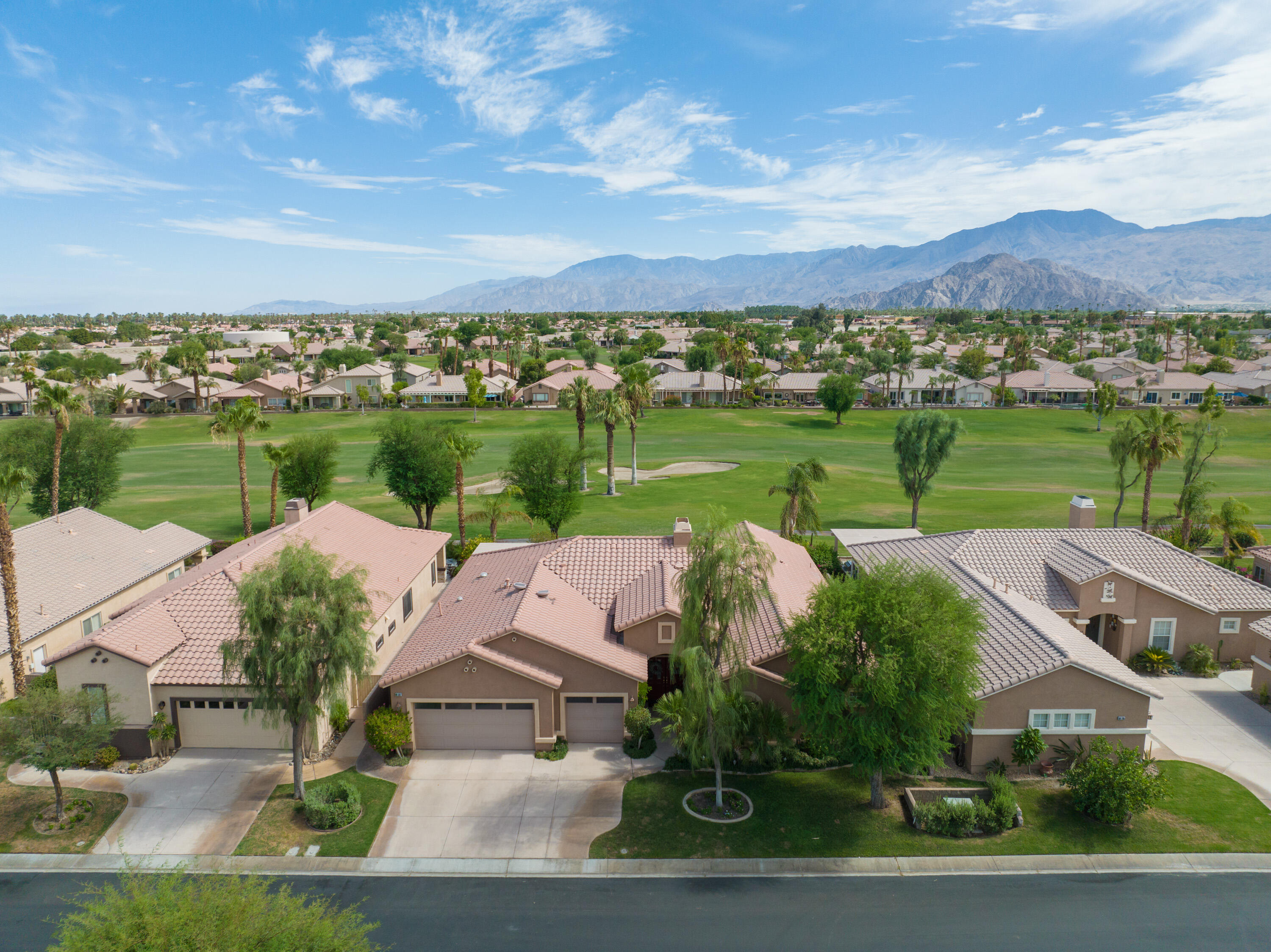 80307 Green Hills Drive Indio, CA 92201 - Photo 2 of 48 an aerial view of house with yard lake and mountain view in back