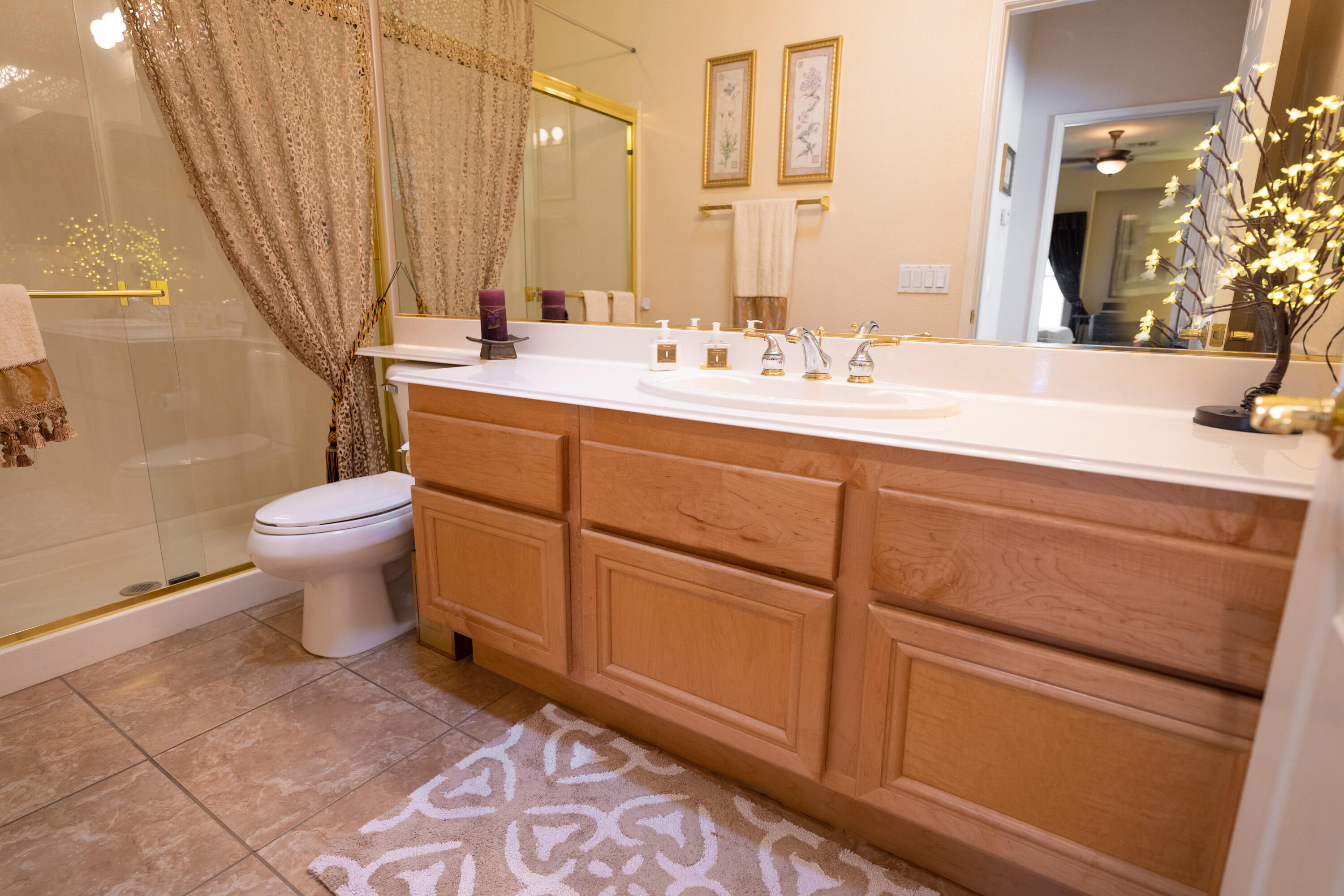 80307 Green Hills Drive Indio, CA 92201 - Photo 27 of 48 a bathroom with a toilet sink and mirror