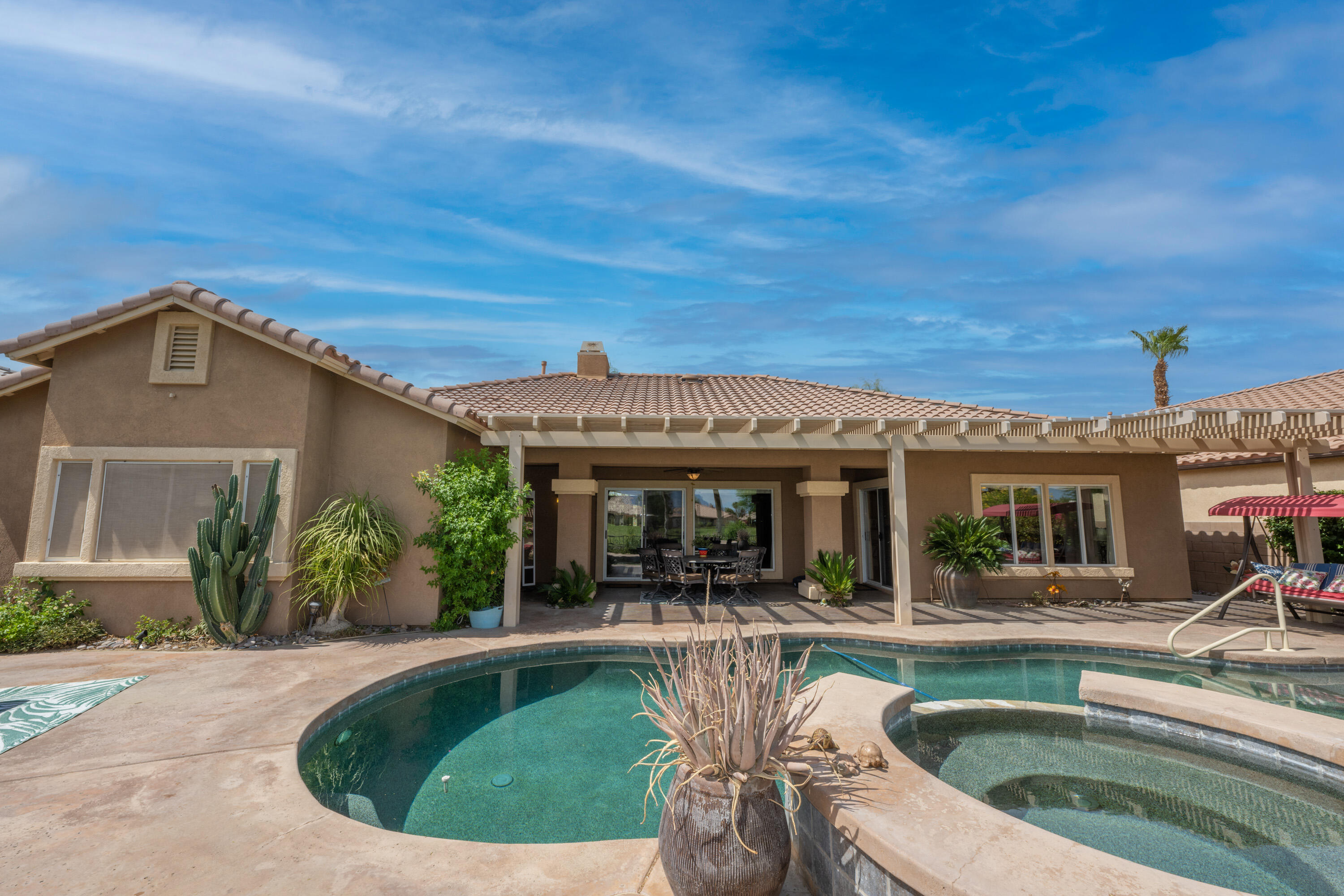 80307 Green Hills Drive Indio, CA 92201 - Photo 31 of 48 a view of house with swimming pool outdoor seating