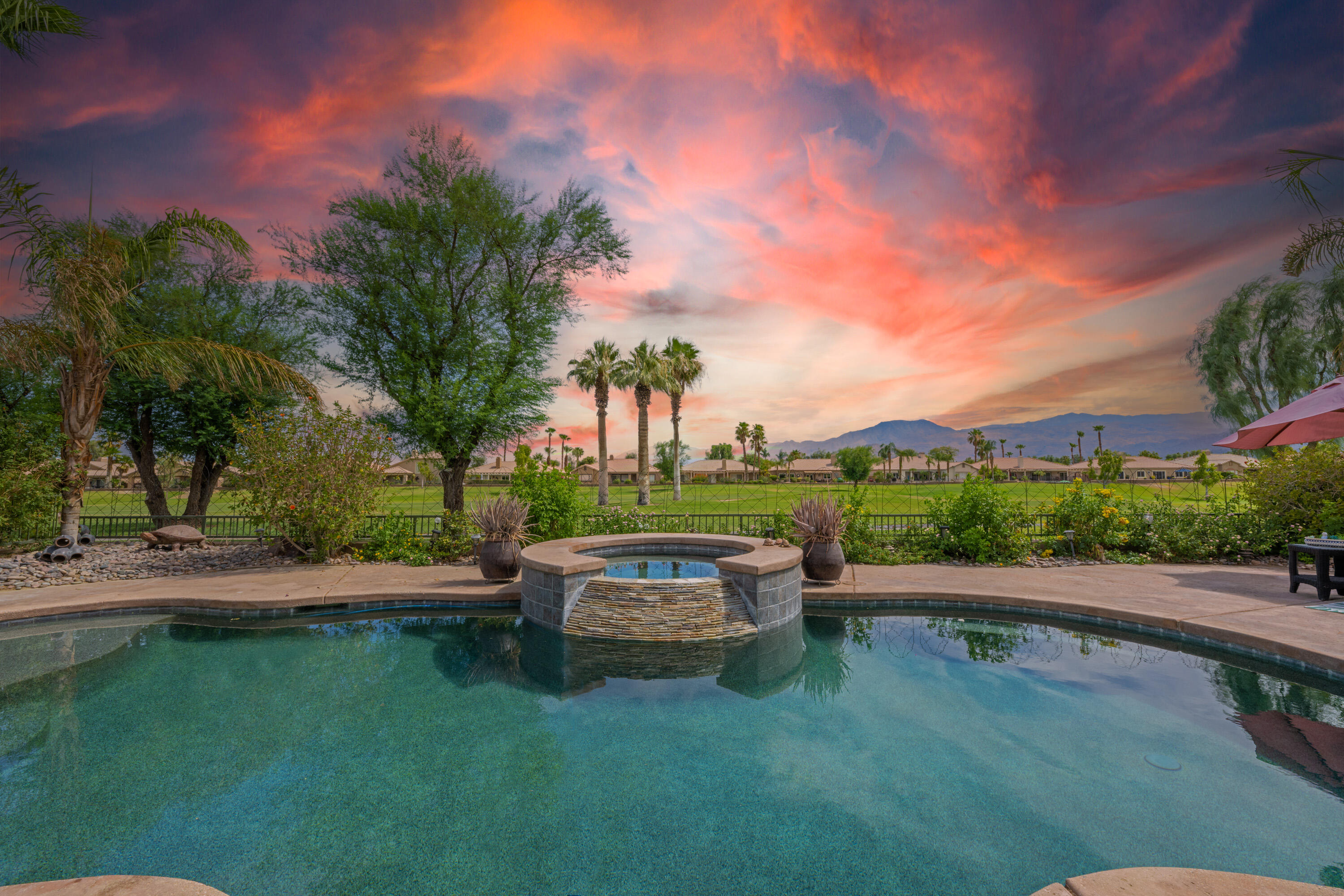 80307 Green Hills Drive Indio, CA 92201 - Photo 34 of 48 a backyard of a house with table and chairs