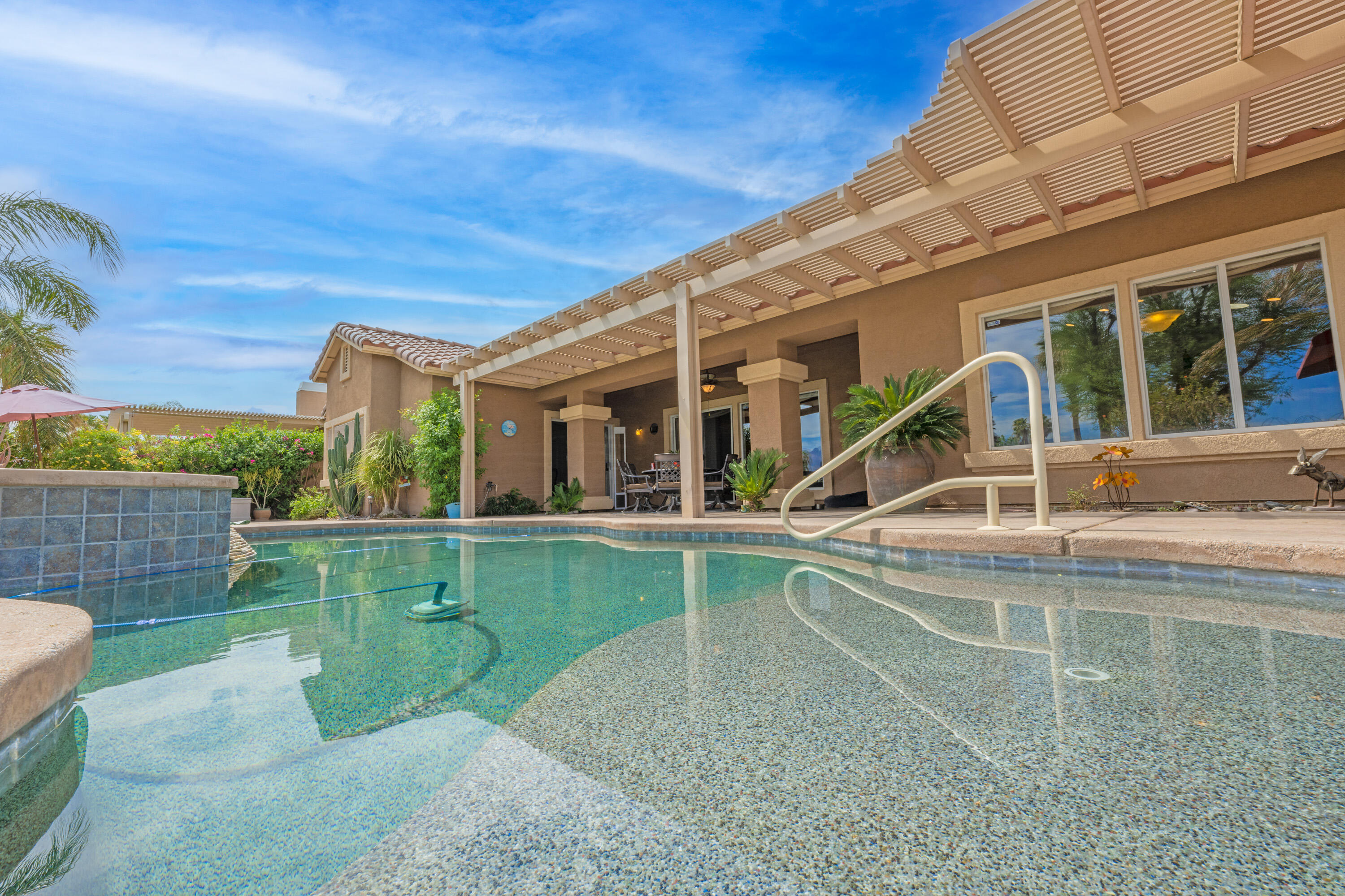80307 Green Hills Drive Indio, CA 92201 - Photo 4 of 48 a view of a house with a backyard