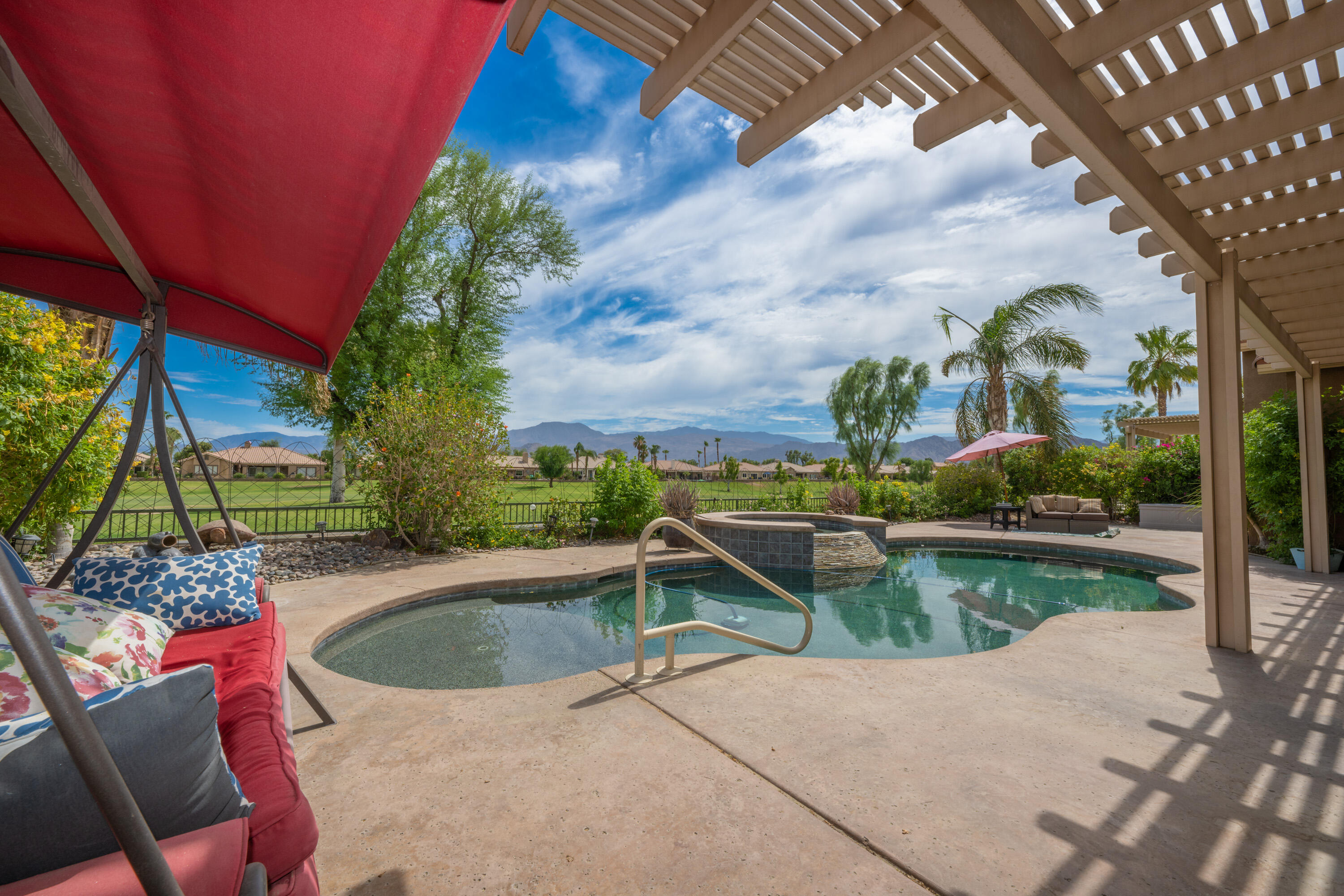 80307 Green Hills Drive Indio, CA 92201 - Photo 5 of 48 a view of a swimming pool with a patio
