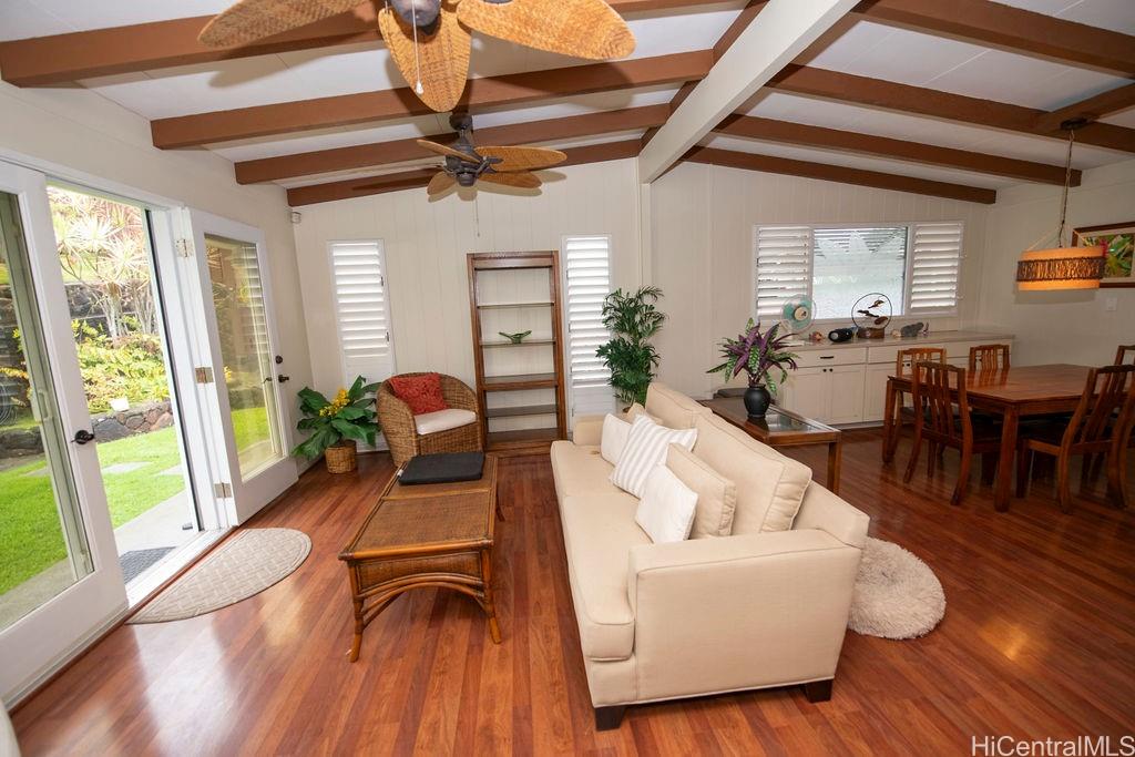 Old family style living / dining room combination leading out to the landscaped backyard.