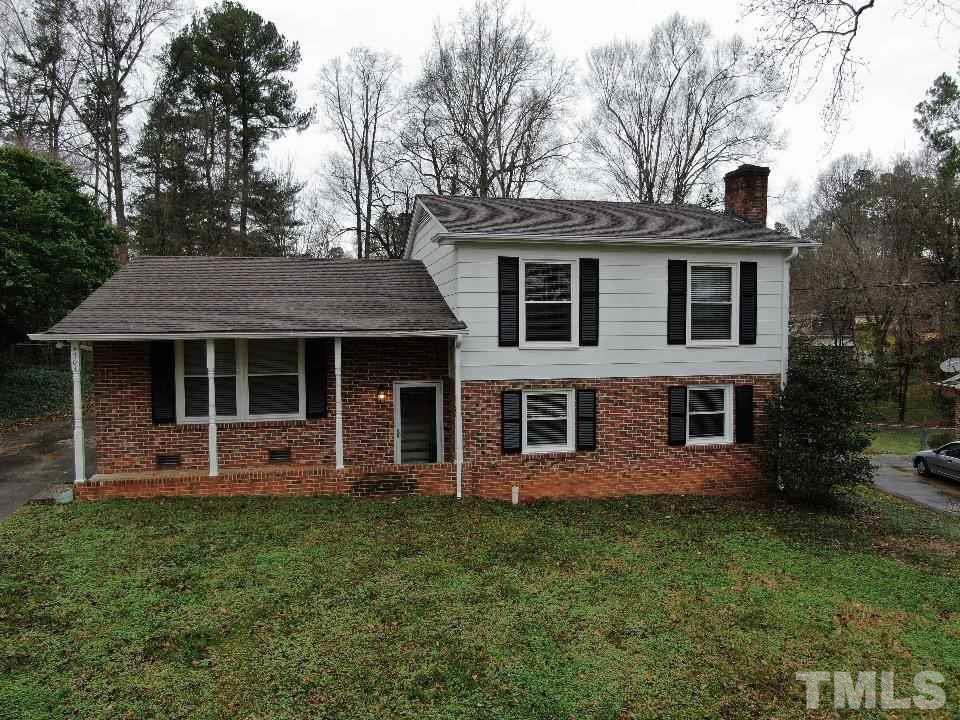 4703 Latimer Road Raleigh, NC 27609 - Photo 1 of 22 a front view of a house with garden