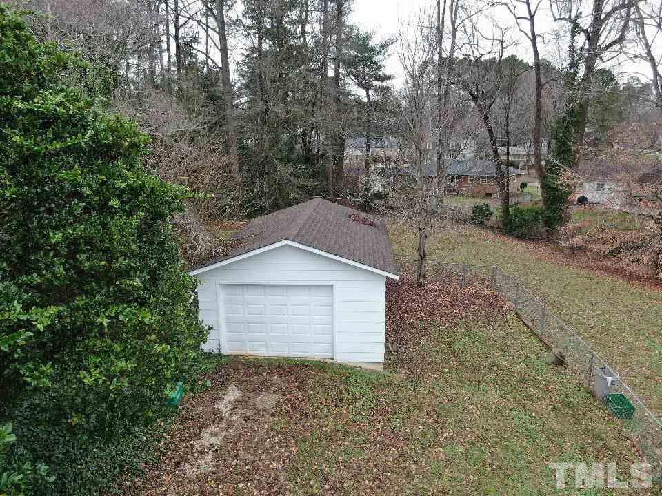 4703 Latimer Road Raleigh, NC 27609 - Photo 22 of 22 a house with trees in front of it