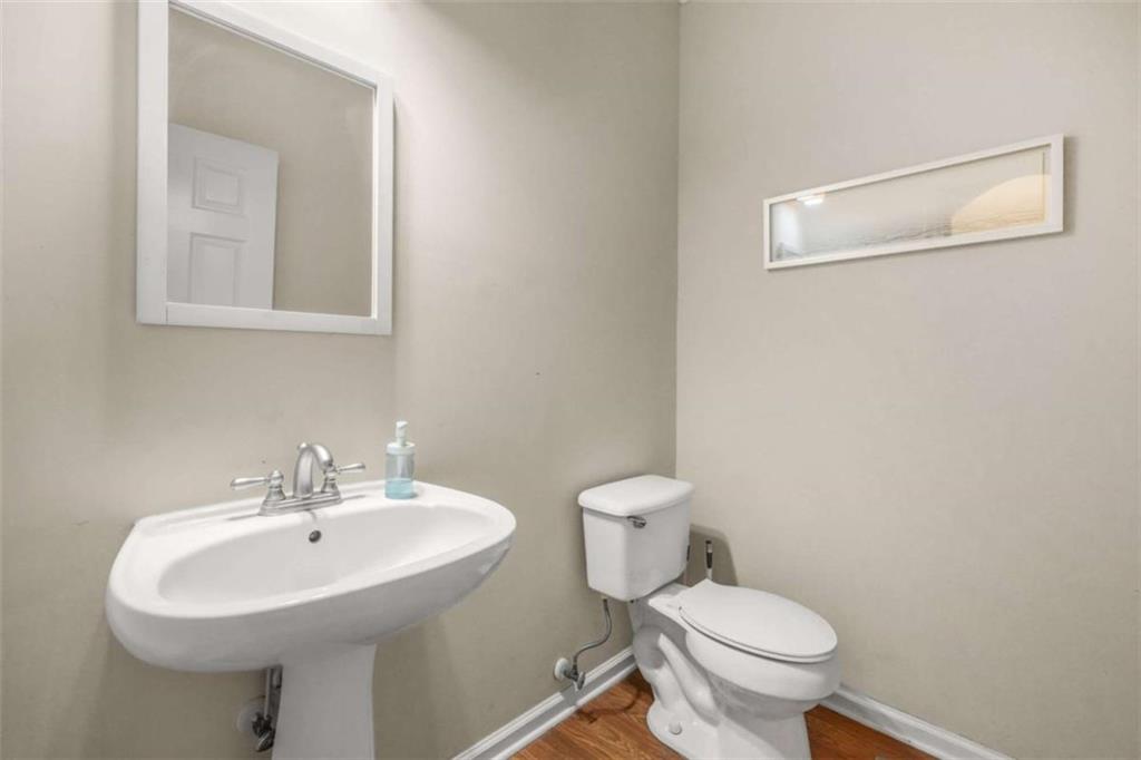 535 Anglewood Trace Stockbridge, GA 30281 - Photo 14 of 73 a bathroom with a sink a toilet and mirror