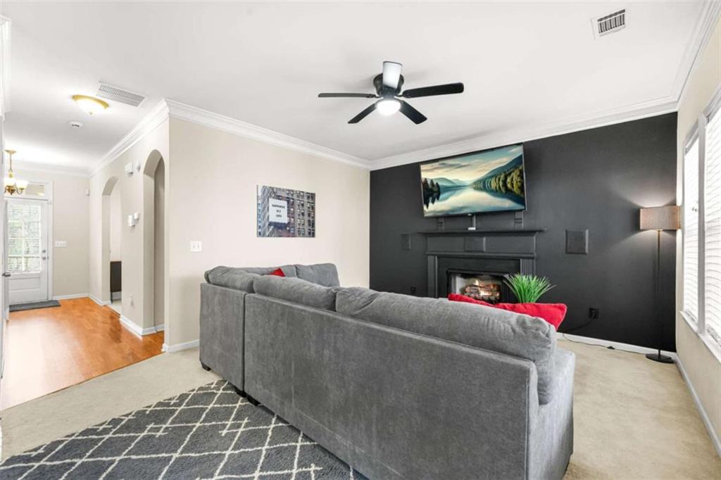 535 Anglewood Trace Stockbridge, GA 30281 - Photo 16 of 73 a living room with furniture and a flat screen tv