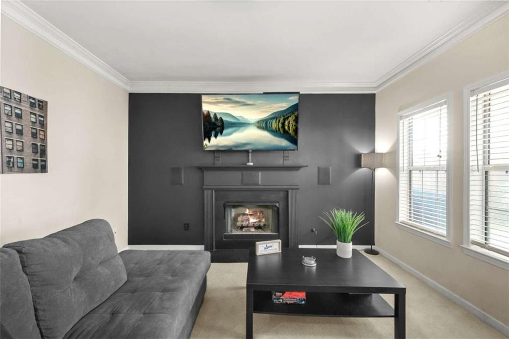 535 Anglewood Trace Stockbridge, GA 30281 - Photo 17 of 73 a living room with furniture and a fireplace