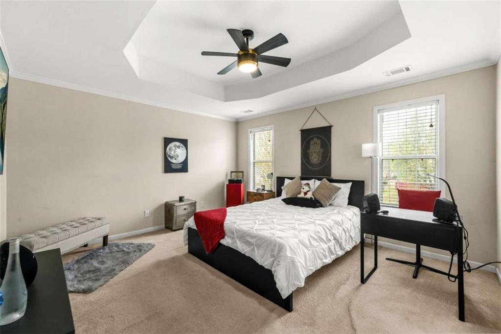 535 Anglewood Trace Stockbridge, GA 30281 - Photo 27 of 73 a bedroom with a bed and a table in it