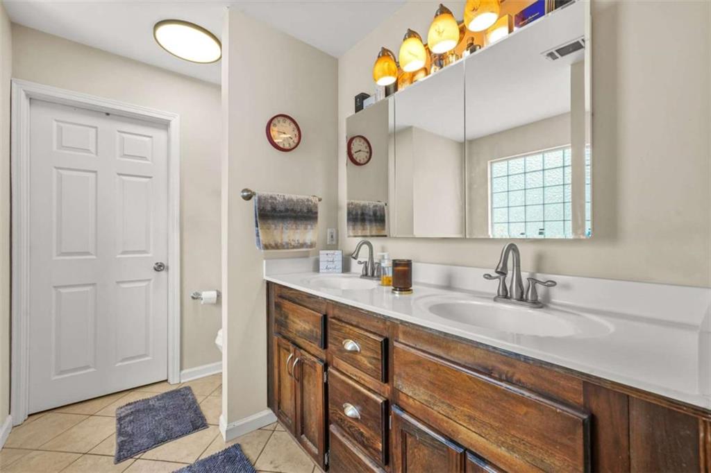535 Anglewood Trace Stockbridge, GA 30281 - Photo 30 of 73 a bathroom with a sink a vanity and a mirror