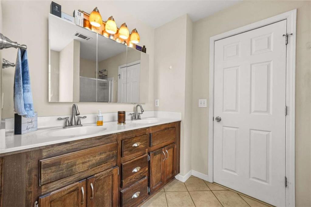 535 Anglewood Trace Stockbridge, GA 30281 - Photo 31 of 73 a bathroom with a double vanity sink mirror and
