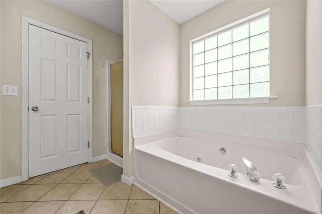 535 Anglewood Trace Stockbridge, GA 30281 - Photo 32 of 73 a white bath tub sitting next to a window