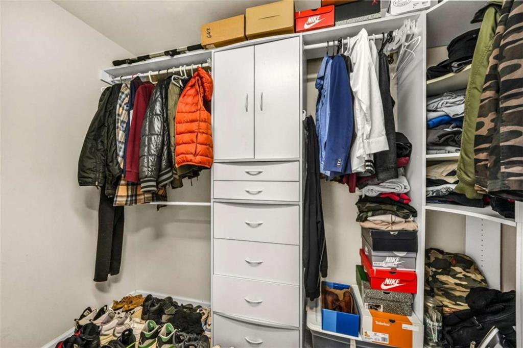 535 Anglewood Trace Stockbridge, GA 30281 - Photo 33 of 73 a view of walk in closet with clothes and shoes