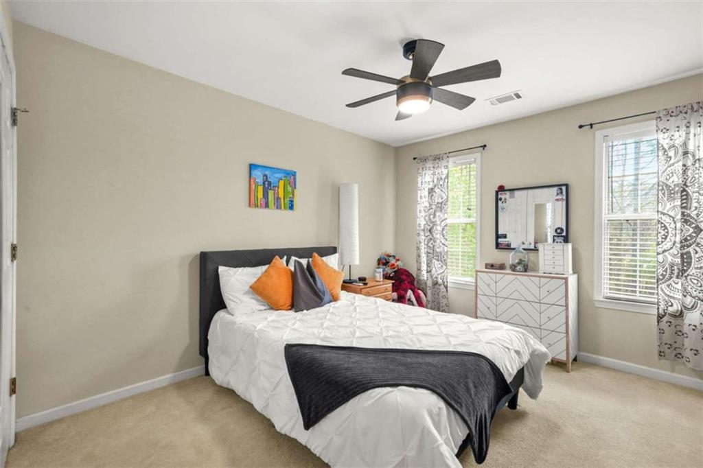 535 Anglewood Trace Stockbridge, GA 30281 - Photo 34 of 73 a bed room with a bed and a chandelier