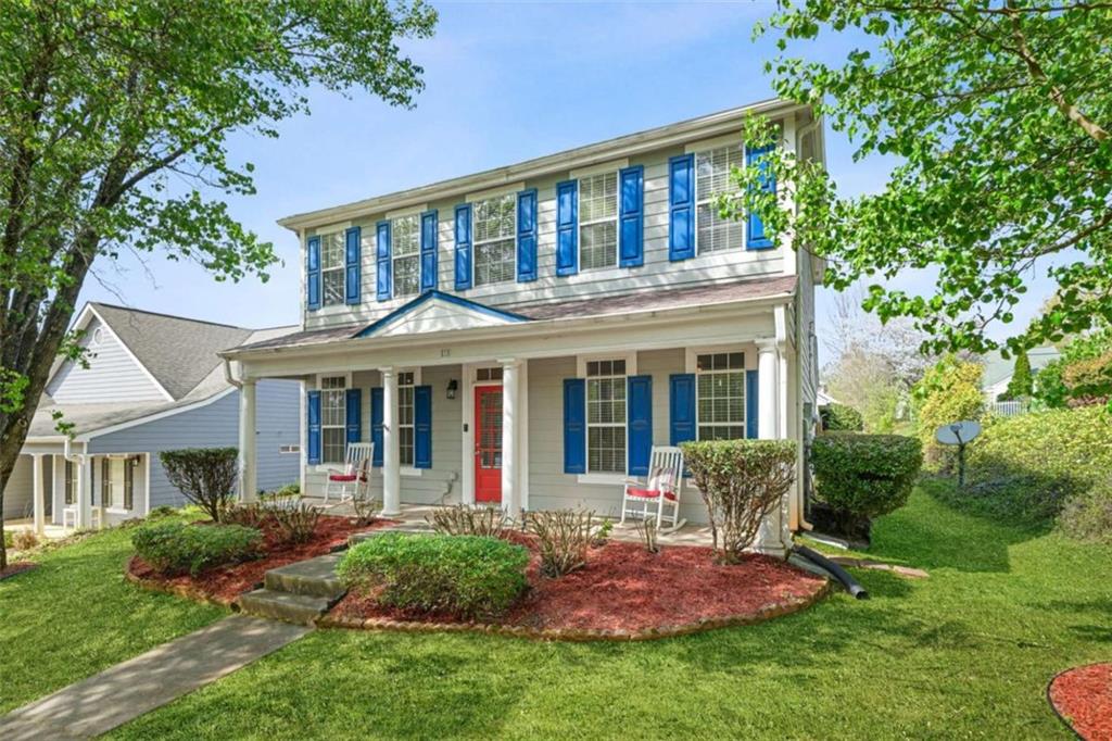 535 Anglewood Trace Stockbridge, GA 30281 - Photo 4 of 73 a view of a white house with a yard and potted plants