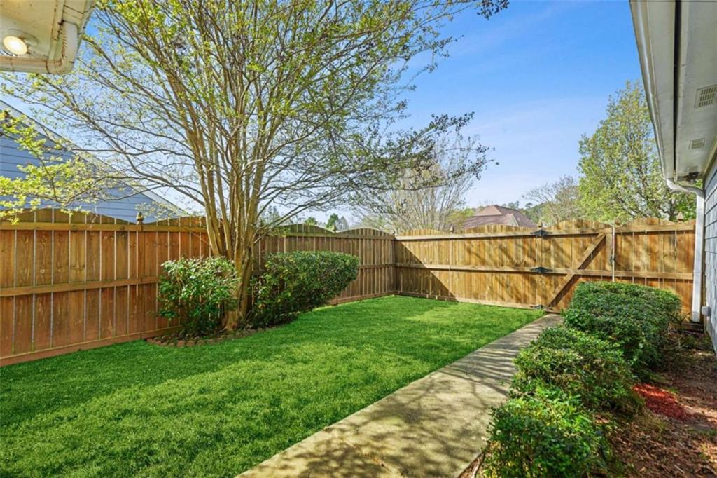 535 Anglewood Trace Stockbridge, GA 30281 - Photo 48 of 73 a backyard of a house with lots of green space