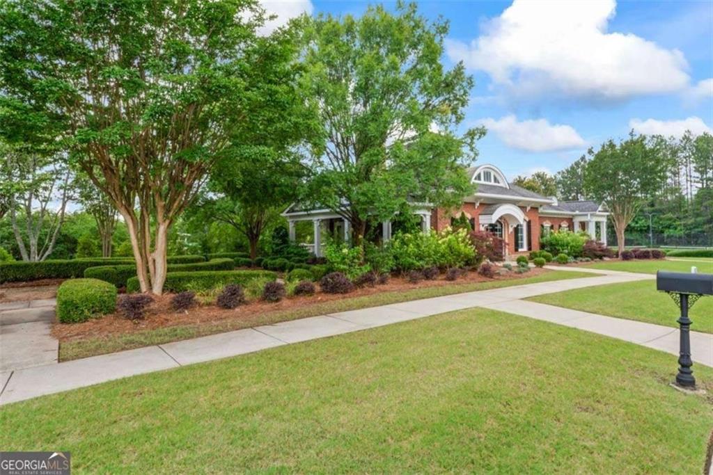 535 Anglewood Trace Stockbridge, GA 30281 - Photo 66 of 73 a front view of a house with a yard and trees