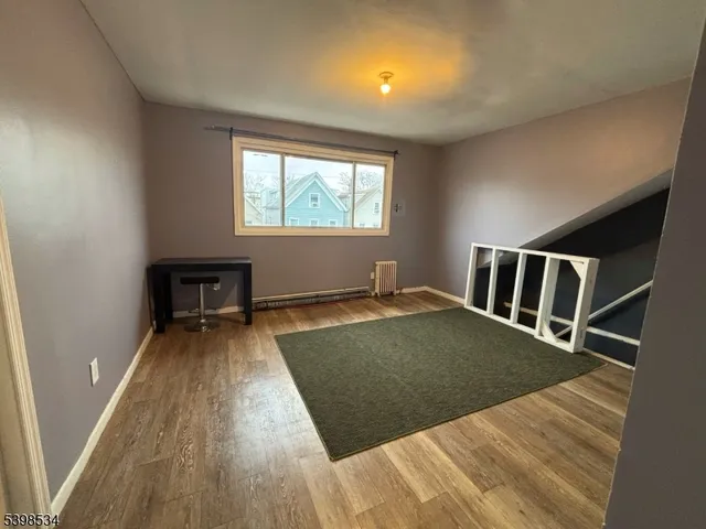 a view of a livingroom with wooden floor