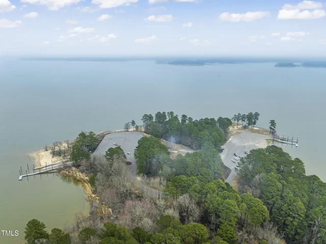 an aerial view of ocean with residential house