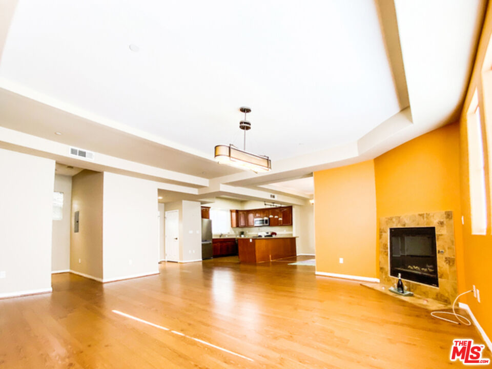904 East Windsor Road, Unit 103 Glendale, CA 91205 - Photo 4 of 18 a view of a livingroom with furniture and a flat screen tv