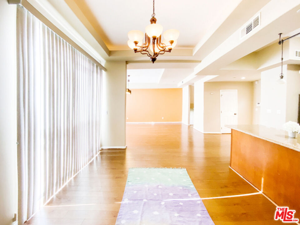 904 East Windsor Road, Unit 103 Glendale, CA 91205 - Photo 6 of 18 a view of a living room with a chandelier