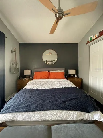 a bedroom with a bed and window