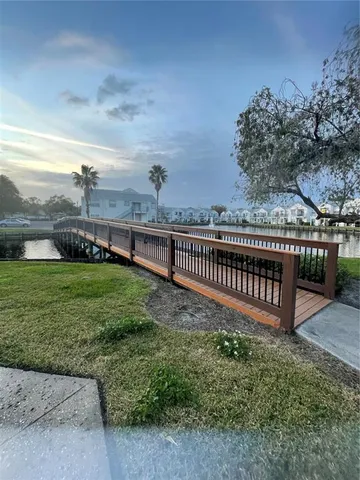 a view of a deck with a yard