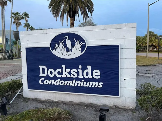 a sign that is on a brick wall