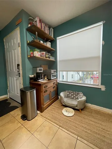 a kitchen with a stove and a refrigerator