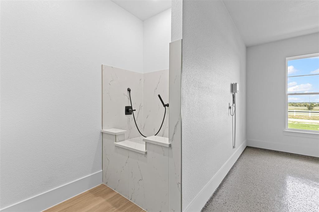 1132 Dobbs Trail Springtown, TX 76082 - Photo 24 of 32 a view of a room with rack on the wall and a window