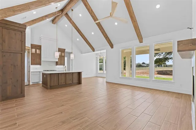 a view of kitchen with cabinets and wooden floor