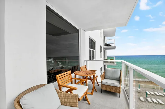 a bathroom with a granite countertop sink mirror and toilet