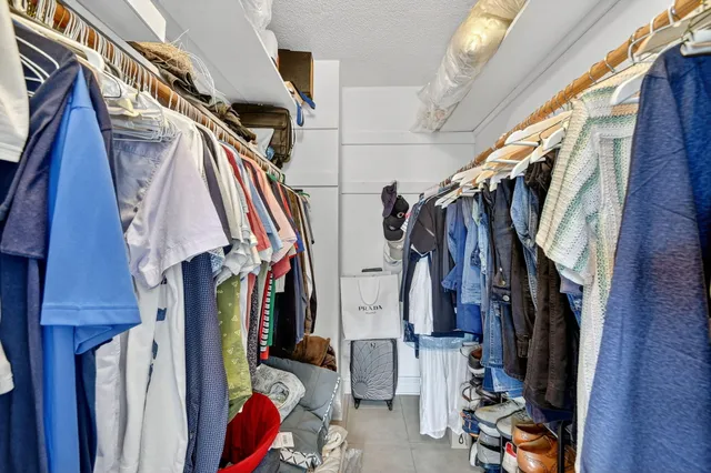 a view of a dining room with furniture and a book shelf