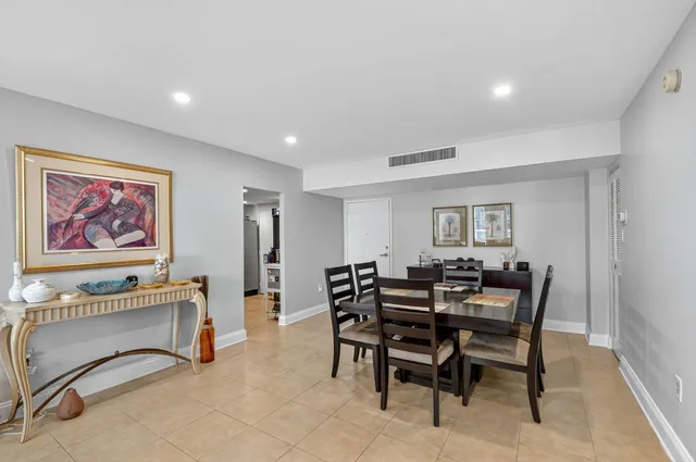 a kitchen with stainless steel appliances granite countertop a sink stove and microwave