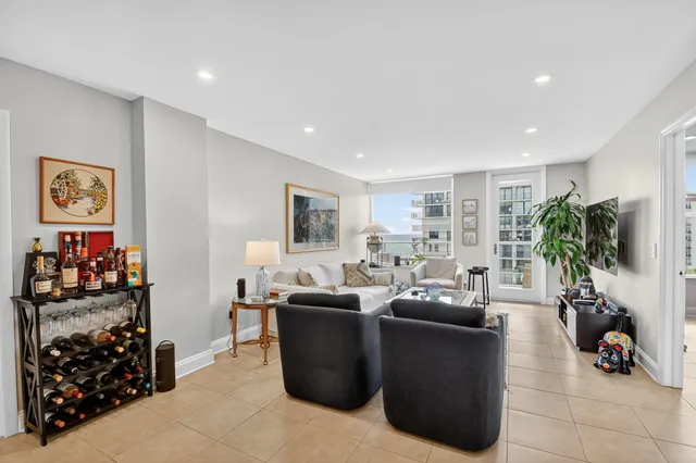 a bedroom with a bed and a wooden floor