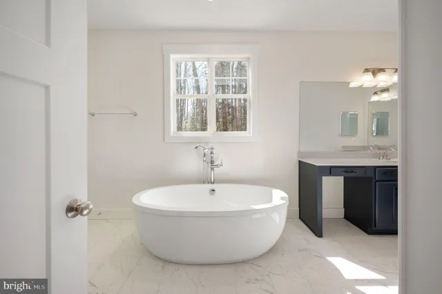 a white bath tub sitting in a bathroom