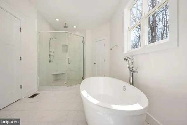 a bathroom with a shower a toilet and a sink