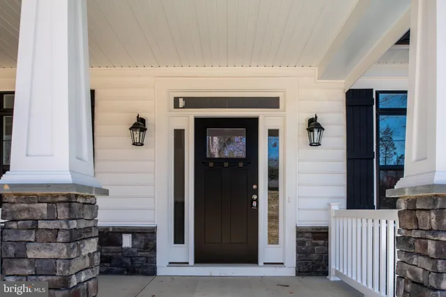 a front view of a house with a glass door