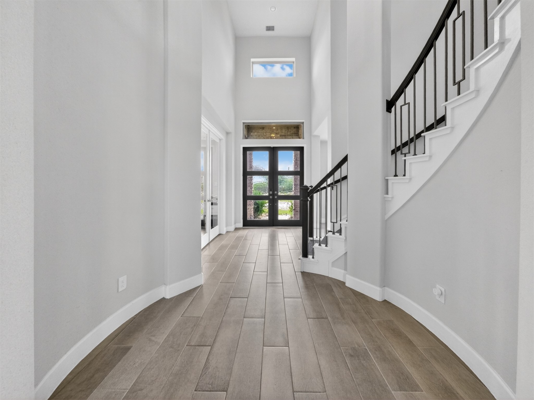 4343 Martin Ridge Drive Manvel, TX 77578 - Photo 11 of 50 a view of an entryway with wooden floor