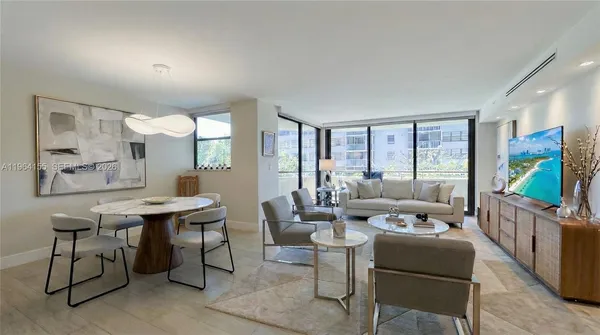a living room with furniture large window and flat screen tv