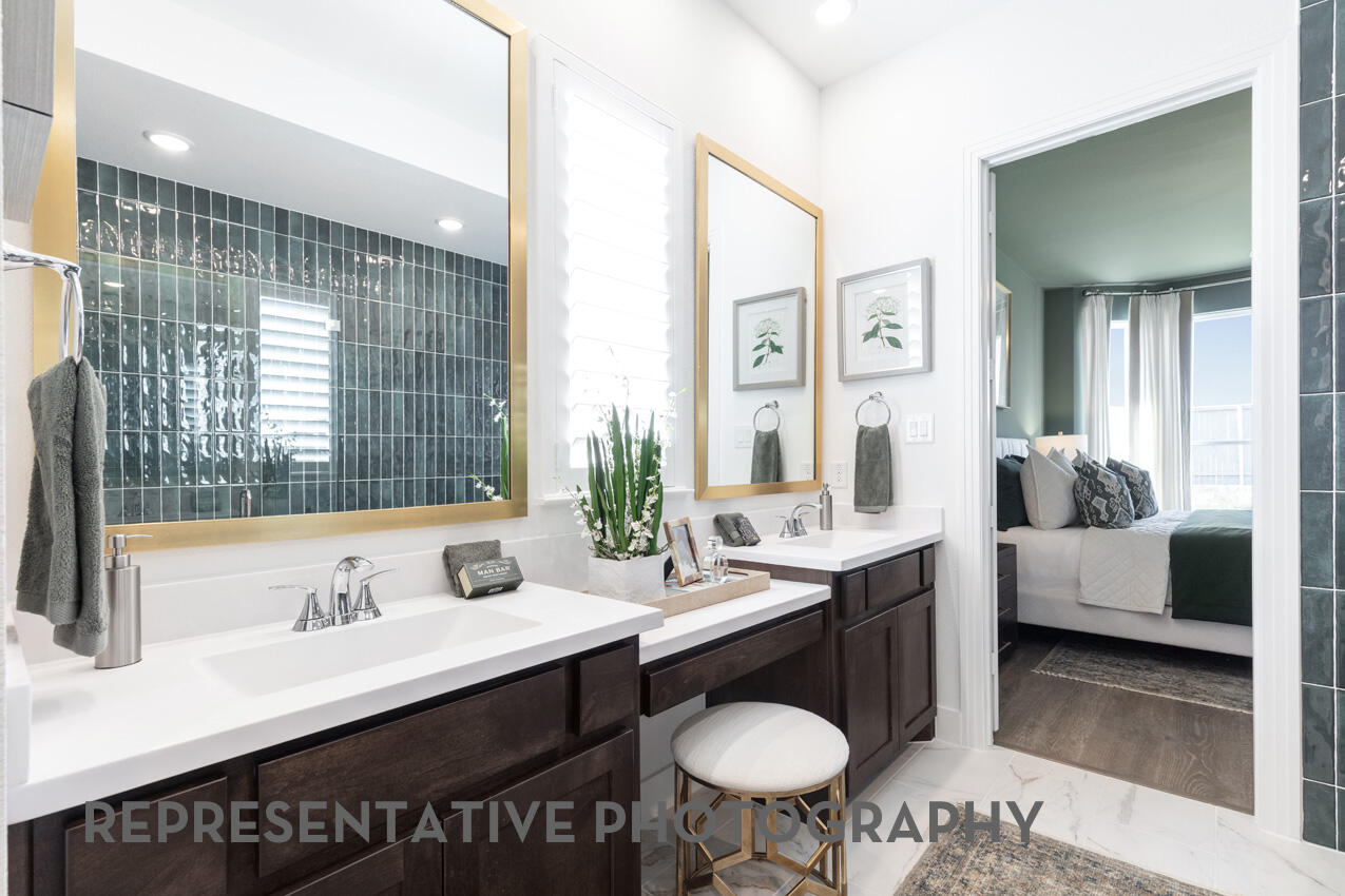 1216 Wolf Cyn Road Georgetown, TX 78628 - Photo 25 of 39 a spacious bathroom with a sink double vanity and a mirror