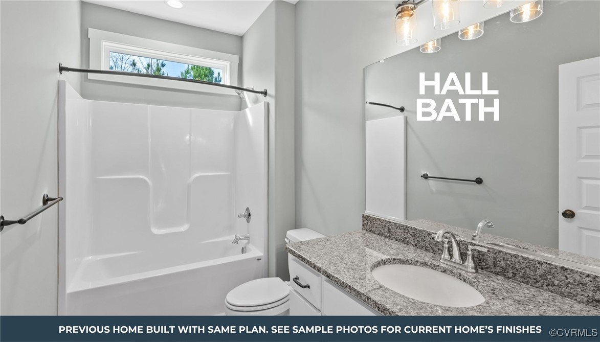 1714 Jerusalem Church Road Buckingham, VA 23921 - Photo 8 of 11 a bathroom with a granite countertop sink a mirror a bathtub and shower