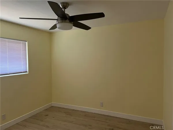 a view of a small space with wooden floor